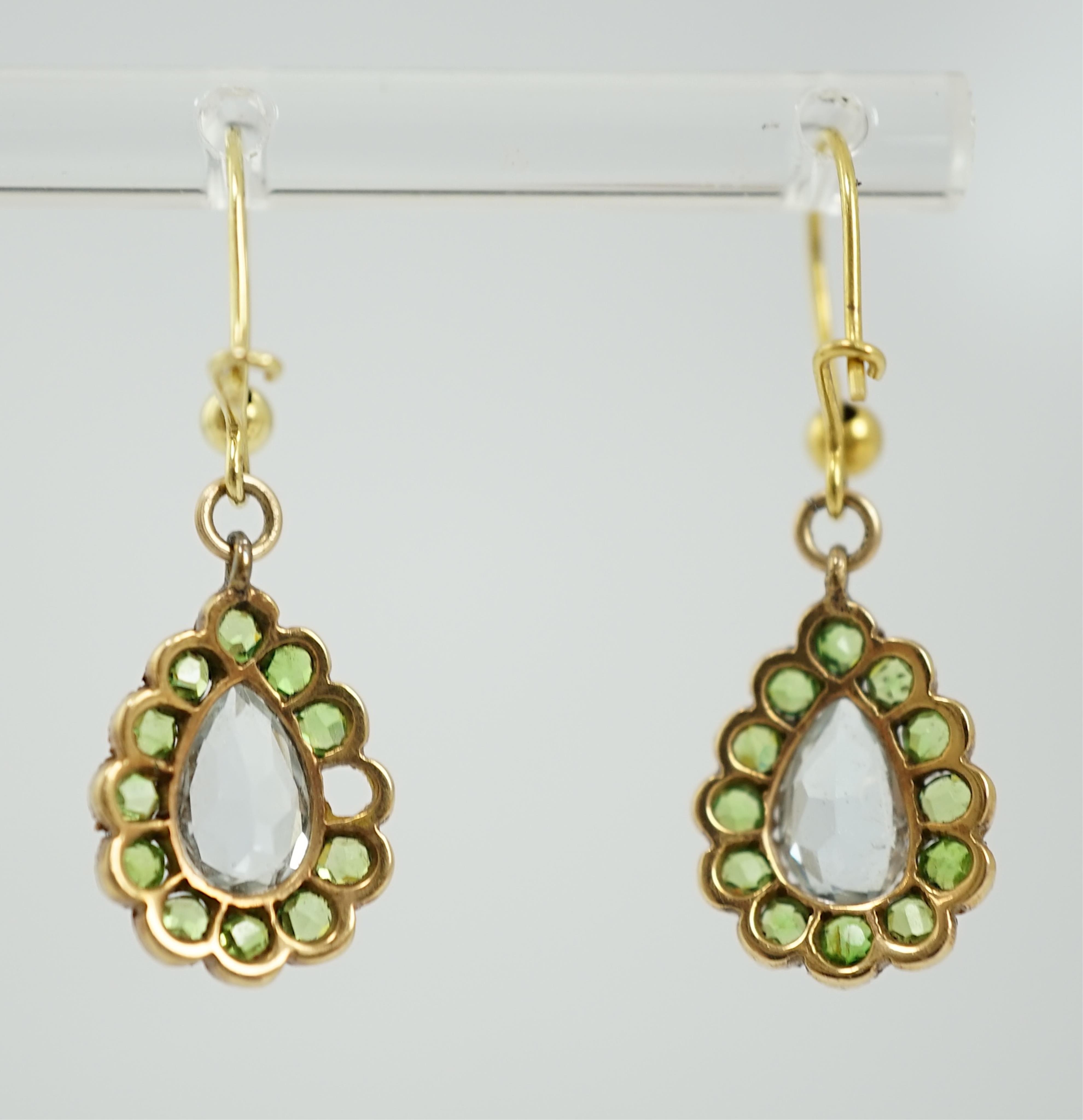 A pair of late Victorian yellow metal, aquamarine and demantoid garnet cluster set pear shaped drop earrings